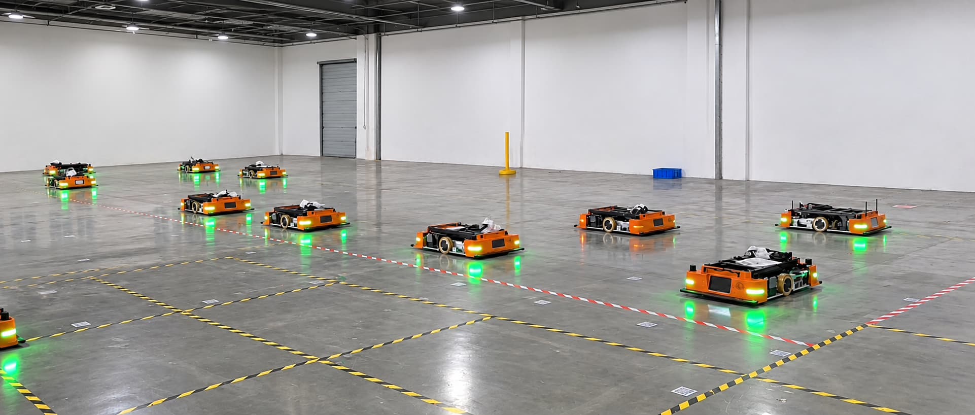 Multiple AMRs operating on an automotive-parts factory floor