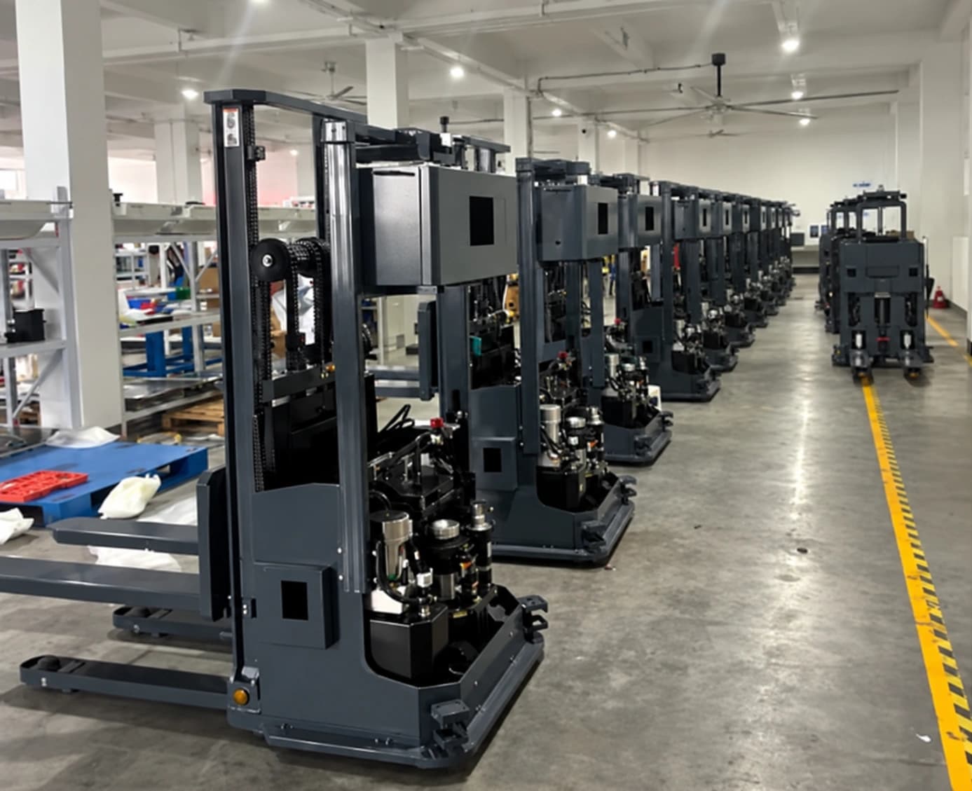 A fleet of stacker AMRs operating inside a battery plant