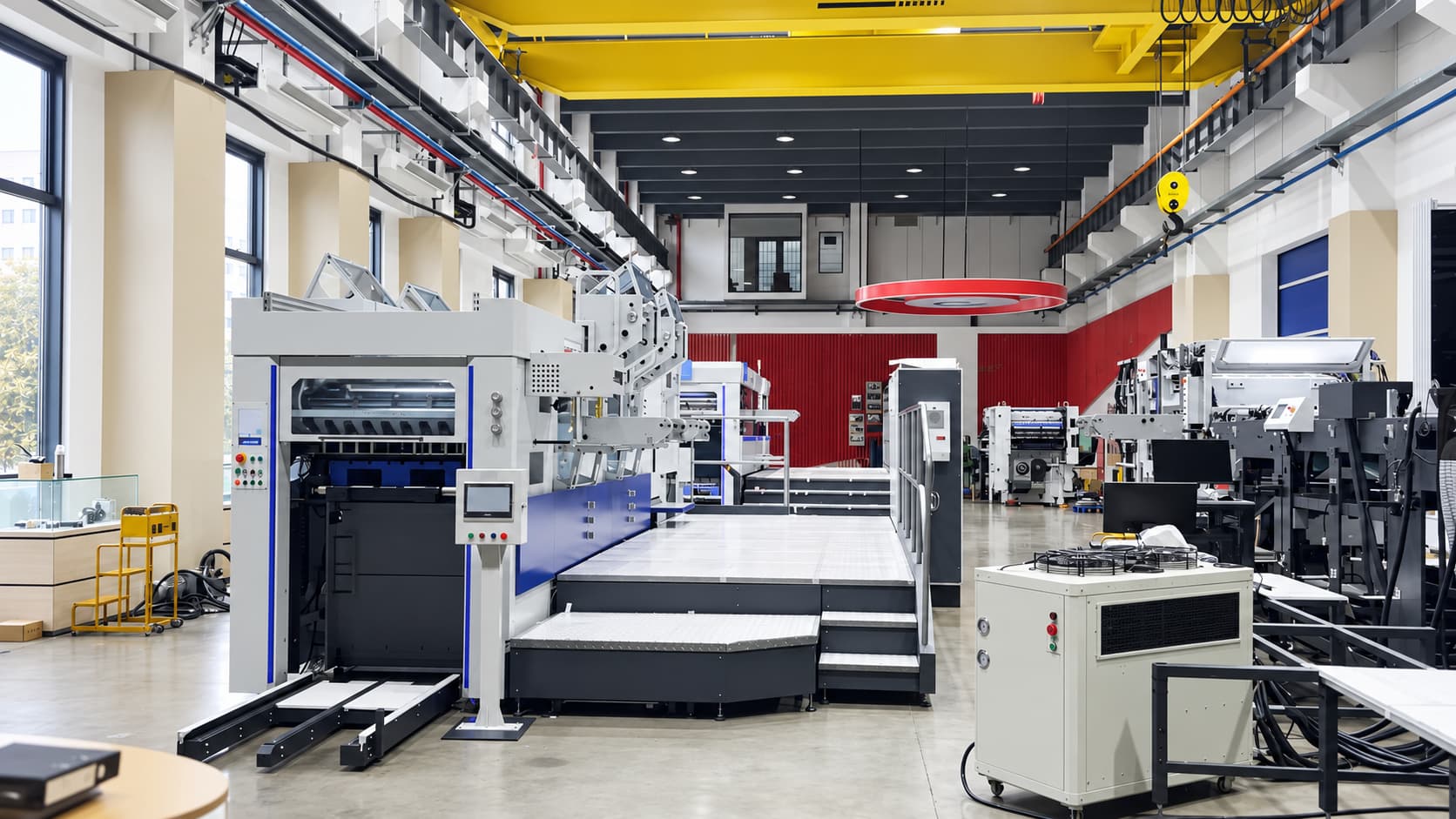 Printing plant floor with production equipment and open handling lanes